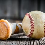 Baseball ball and a wooden stick