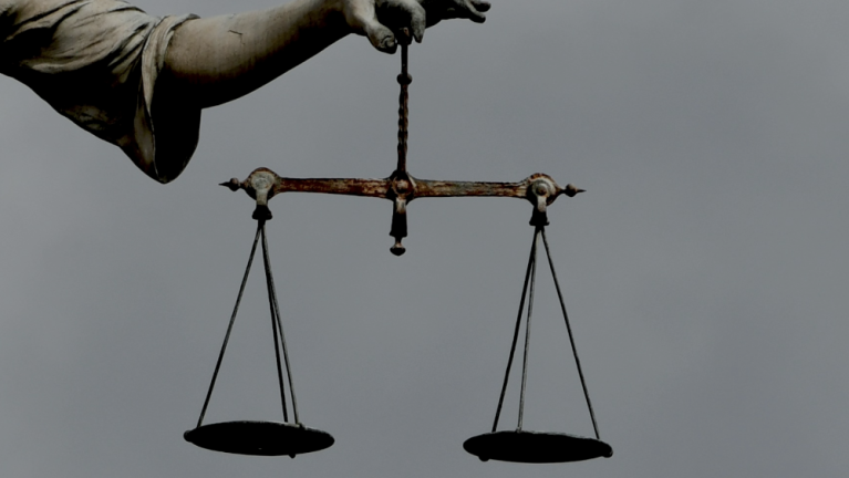 scales of justice gods justice sightline 1 Scales of justice being held by a statue